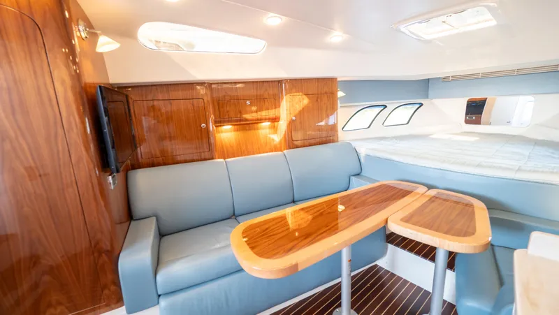 Slide: The Image of Luxurious interior of 2018 Intrepid 430 Sport Yacht with elegant seating and wooden finishes. - 43