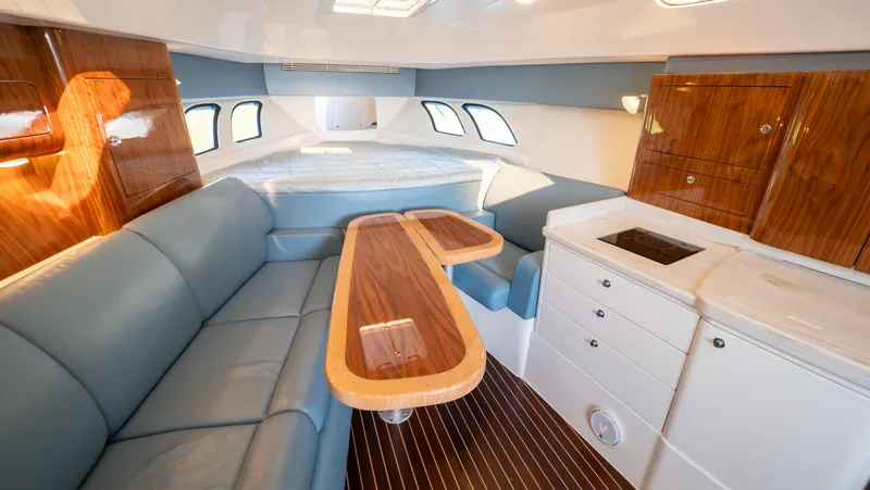 Slide: The Image of Luxurious interior of 2018 Intrepid 430 Sport Yacht with elegant seating and wooden cabinetry. - 45