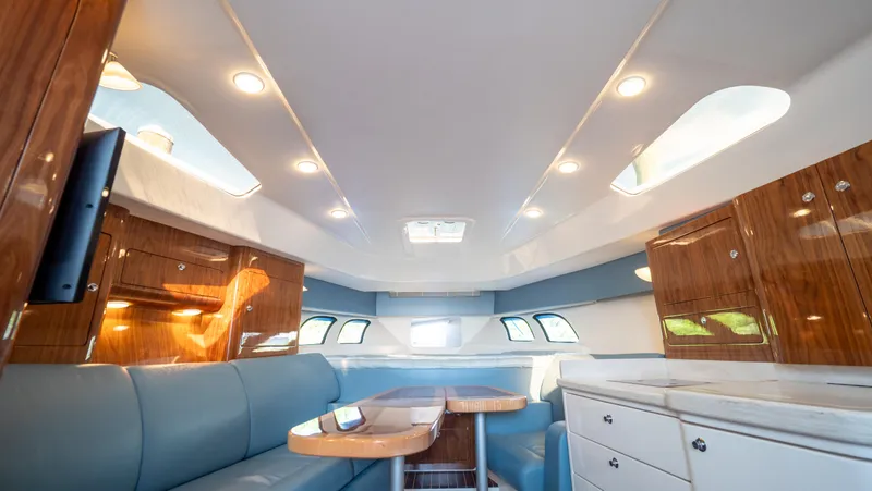 Slide: The Image of Luxurious interior of 2018 Intrepid 430 Sport Yacht with elegant seating and cabinetry. - 46