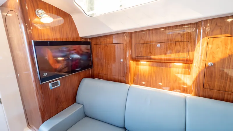 Slide: The Image of Luxurious interior of 2018 Intrepid 430 Sport Yacht with wood paneling and modern amenities. - 49