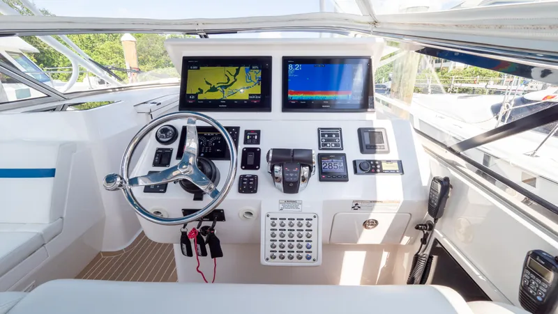 Slide: The Image of Helm of 2018 Intrepid 430 Sport Yacht with dual displays and modern controls. - 6