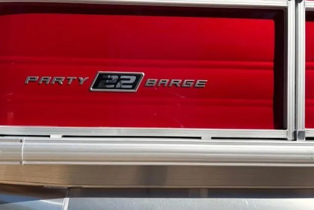 Slide: The Image of 2026 Sun Tracker Party Barge 22 RF DLX, red exterior detail. - 4