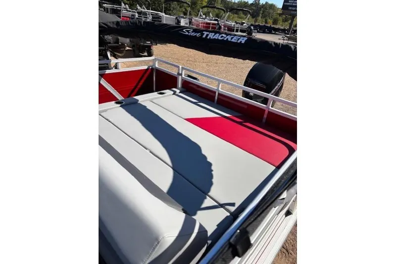 Slide: The Image of 2026 Sun Tracker Party Barge 22 RF DLX with cushioned seating and sleek design. - 8
