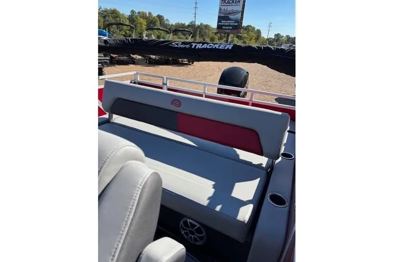 Slide: The Image of 2026 Sun Tracker Party Barge 22 RF DLX interior seating with cup holders. - 9