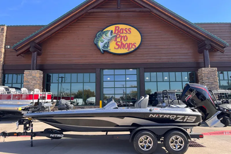 The Image of 2026 Nitro Z19 XL Pro boat displayed outside Bass Pro Shops. - 0