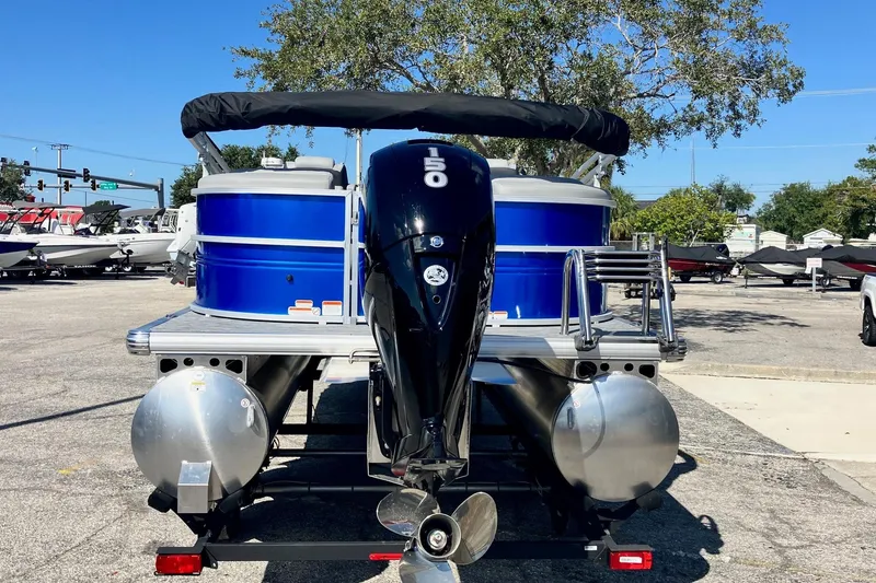 Slide: The Image of 2026 Sun Tracker Party Barge 22 DLX pontoon boat with powerful outboard motor. - 4