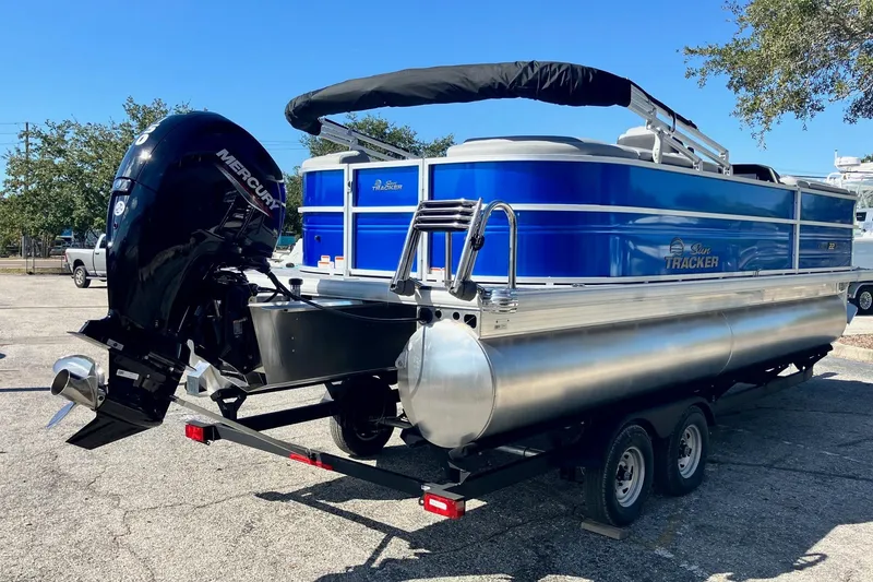 Slide: The Image of 2026 Sun Tracker Party Barge 22 DLX pontoon boat with Mercury outboard motor. - 5
