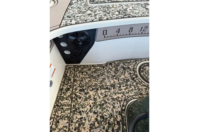 Slide: The Image of 2026 Mako 18 Pro Skiff Backwater Edition with camouflage flooring and measurement markings. - 14