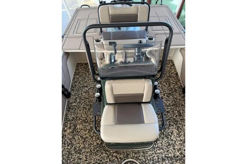 Slide: The Image of 2026 Mako 18 Pro Skiff Backwater Edition interior with dual seats and console. - 8