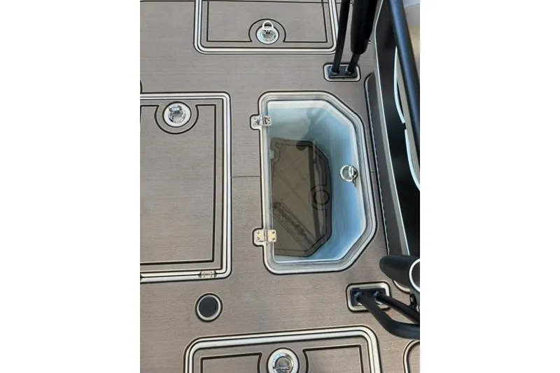 Slide: The Image of 2026 Mako 18 Pro Skiff Backwater Edition deck with storage compartments. - 9