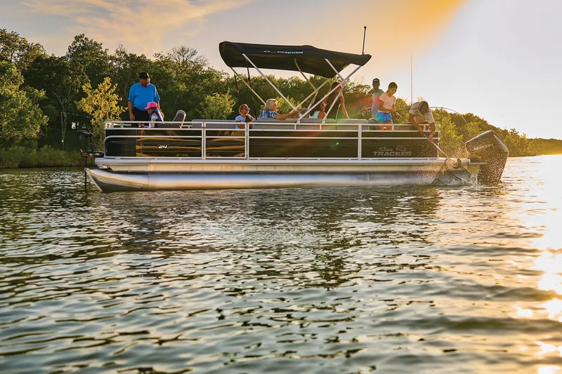 Slide: The Image of 2026 Sun Tracker Sportfish 24 XP3 pontoon boat interior with seating and steering console. - 5