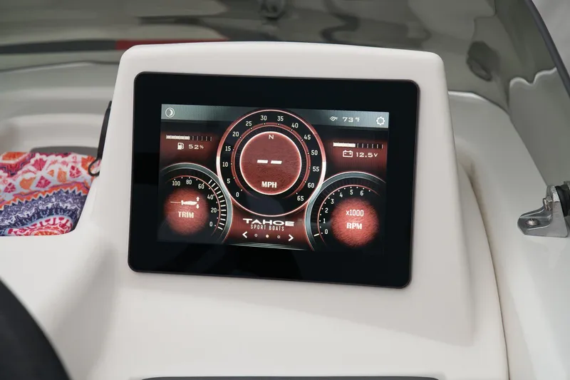 Slide: The Image of 2026 Tahoe T18 boat interior with speaker and safety labels. - 18