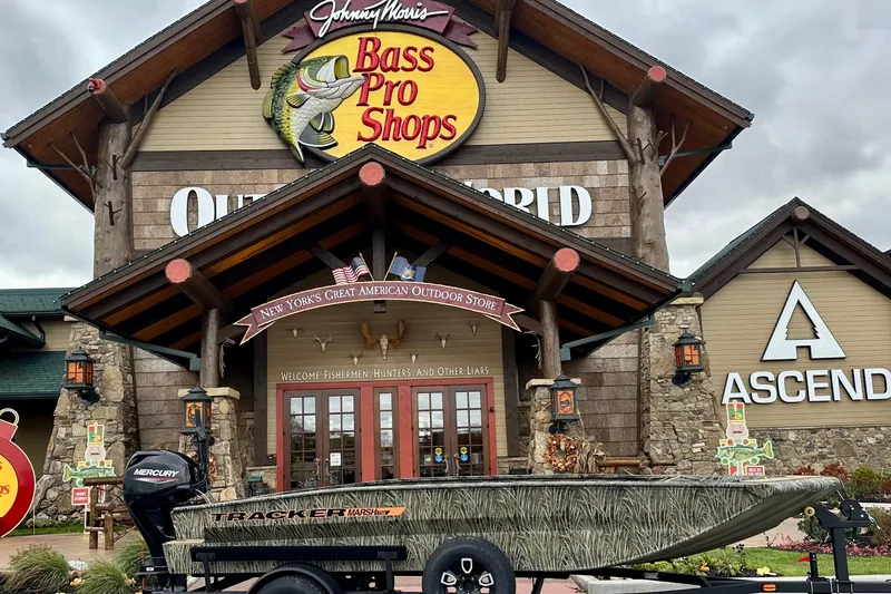 The Image of 2026 Tracker Grizzly 1756 T Marsh boat displayed at Bass Pro Shops entrance. - 0