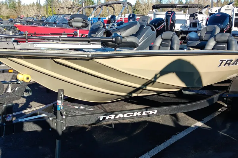 The Image of 2026 Tracker Pro Team 195 boat on trailer in outdoor showroom. - 0