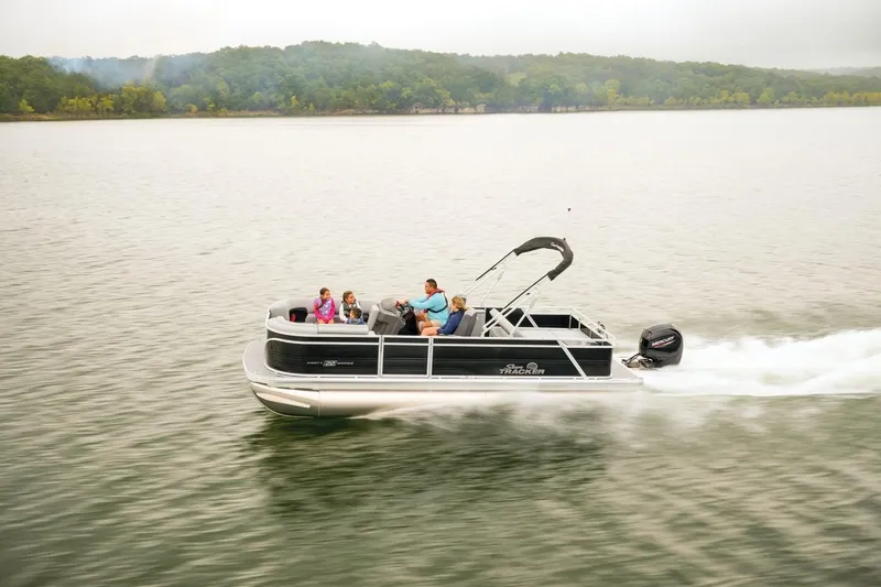 Slide: The Image of 2026 Sun Tracker Party Barge 22 RF DLX cruising on a serene lake. - 9