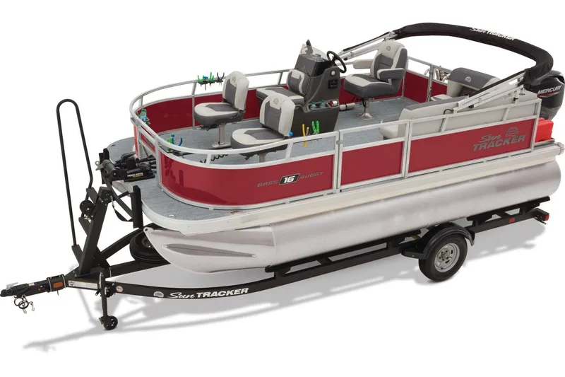 The Image of 2026 Sun Tracker Bass Buggy 16 XL Select pontoon boat on trailer, parked outdoors. - 0