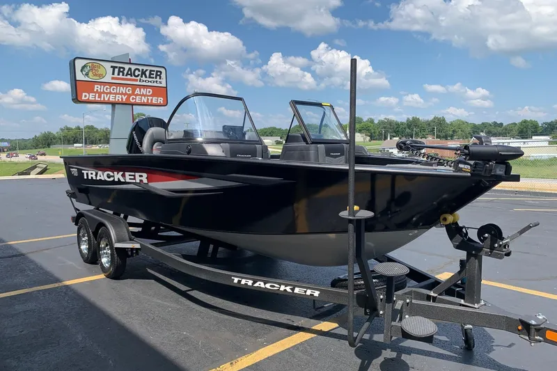 Slide: The Image of 2026 Tracker Targa V-19 WT boat at rigging and delivery center under blue sky. - 2
