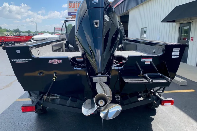Slide: The Image of 2026 Tracker Targa V-19 WT boat rear view with powerful outboard motor. - 3