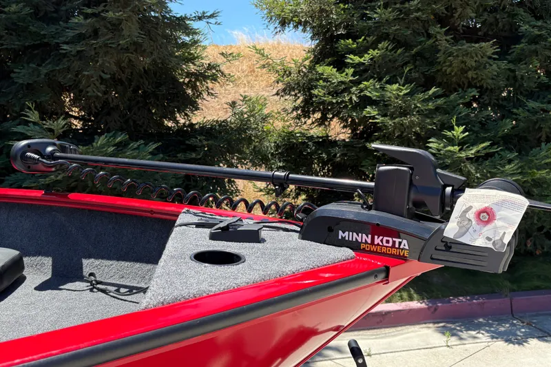 Slide: The Image of Red Tracker Pro Guide V-175 WT boat with Minn Kota PowerDrive motor, 2026 model. - 14