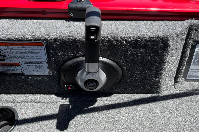 Slide: The Image of Throttle control on 2026 Tracker Pro Guide V-175 WT boat, with warning labels visible. - 27