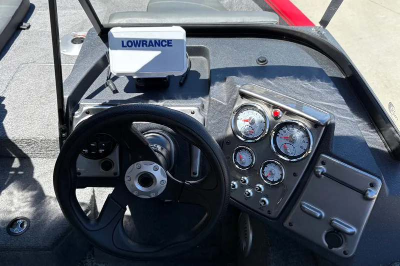 Slide: The Image of Dashboard of 2026 Tracker Pro Guide V-175 WT boat with steering wheel and gauges. - 15