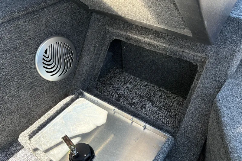 Slide: The Image of Interior of 2026 Tracker Pro Guide V-175 WT boat with speaker and storage compartment. - 29