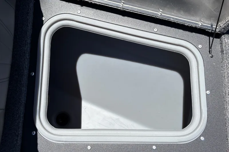 Slide: The Image of Storage compartment of 2026 Tracker Pro Guide V-175 WT boat, open and empty. - 22