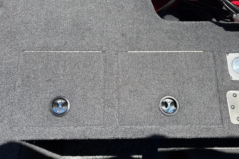 Slide: The Image of Carpeted deck of 2026 Tracker Pro Guide V-175 WT boat with storage compartments. - 44