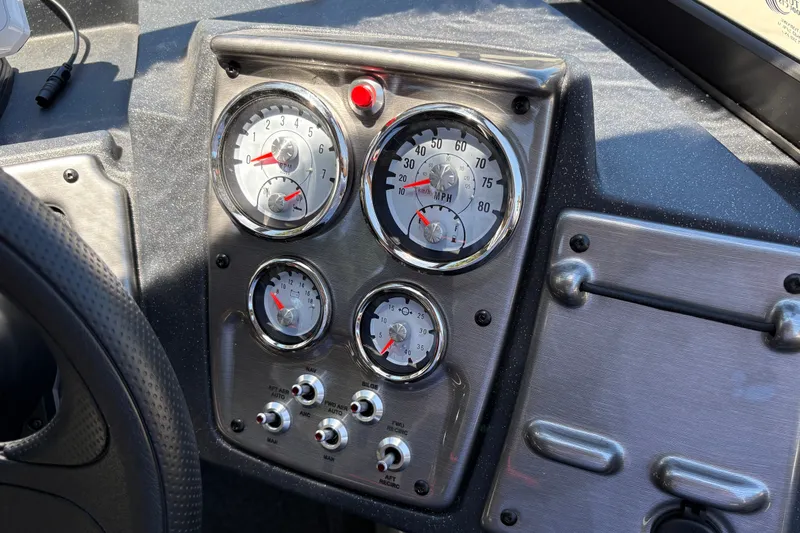 Slide: The Image of Dashboard of 2026 Tracker Pro Guide V-175 WT boat with gauges and controls. - 16