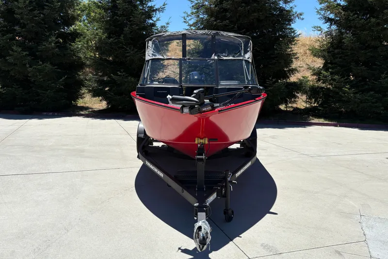 Slide: The Image of 2026 Tracker Pro Guide V-175 WT boat on trailer, parked outdoors. - 12