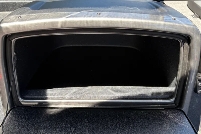 Slide: The Image of Storage compartment of 2026 Tracker Pro Guide V-175 WT boat, open and empty. - 21