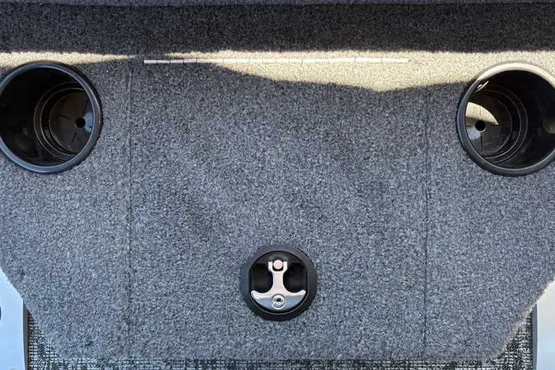 Slide: The Image of Carpeted deck of 2026 Tracker Pro Guide V-175 WT boat with cup holders and latch. - 42