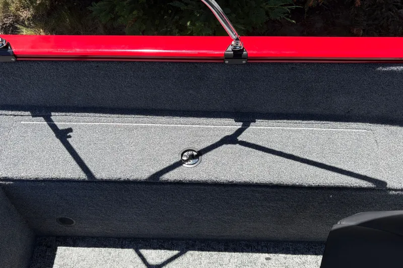 Slide: The Image of 2026 Tracker Pro Guide V-175 WT boat interior with red trim and carpeted surface. - 28