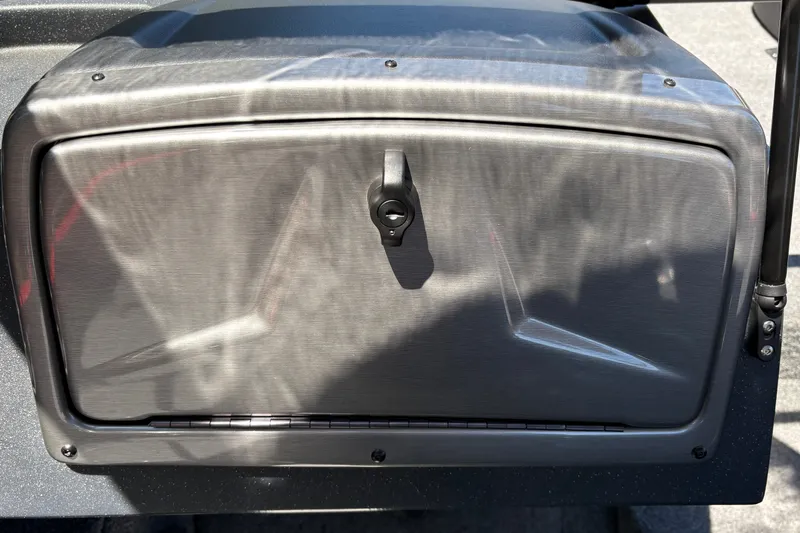 Slide: The Image of 2026 Tracker Pro Guide V-175 WT storage compartment with sleek metallic finish. - 26