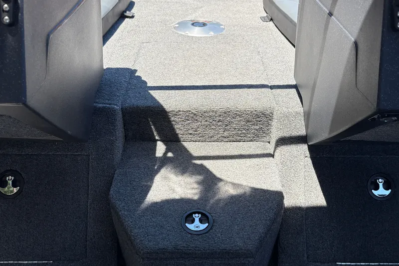 Slide: The Image of Interior view of 2026 Tracker Pro Guide V-175 WT boat, featuring carpeted flooring and seating. - 24