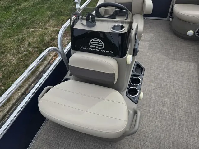 Slide: The Image of 2025 Sun Tracker Bass Buggy 16 XL Select boat interior with seating and console. - 13