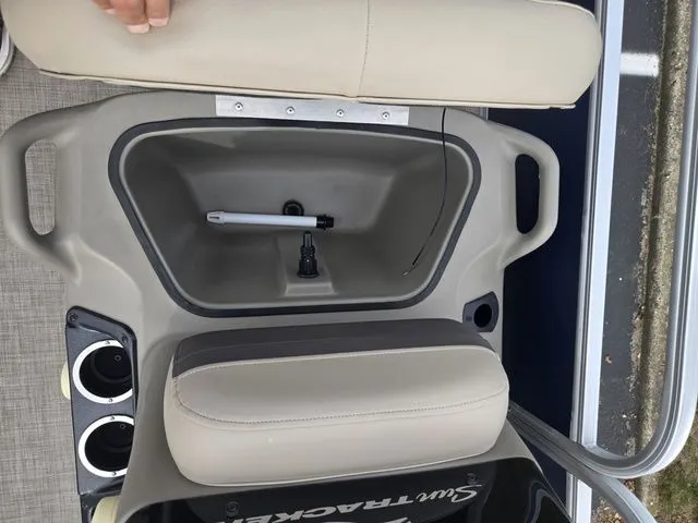 Slide: The Image of 2025 Sun Tracker Bass Buggy 16 XL Select boat seat with storage compartment and cup holders. - 14
