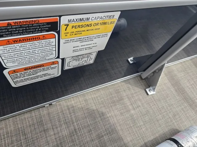 Slide: The Image of 2025 Sun Tracker Bass Buggy 16 XL Select capacity warning label, 7 persons or 1090 lbs limit. - 17