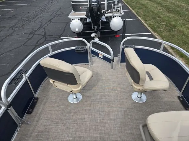 Slide: The Image of 2025 Sun Tracker Bass Buggy 16 XL Select pontoon boat with beige seating and spacious deck. - 23