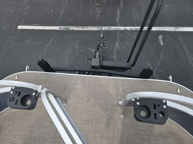 Slide: The Image of 2025 Sun Tracker Bass Buggy 16 XL Select boat trailer hitch and deck view. - 24