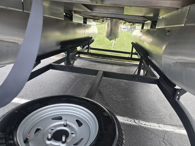 Slide: The Image of Underneath view of a 2025 Sun Tracker Bass Buggy 16 XL Select pontoon boat on a trailer. - 8