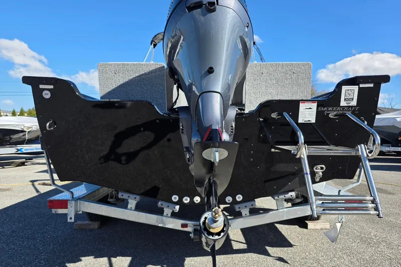 Slide: The Image of 2026 Smoker Craft Adventurer 178 DC boat rear view with motor and ladder. - 10