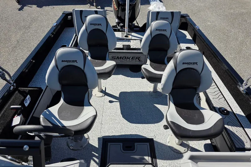 Slide: The Image of 2026 Smoker Craft Adventurer 178 DC boat interior with four cushioned seats. - 16