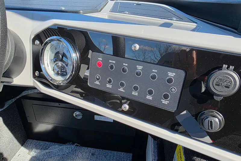 Slide: The Image of 2026 Smoker Craft Adventurer 178 DC dashboard with gauges and control panel. - 18