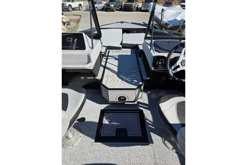 Slide: The Image of 2026 Smoker Craft Adventurer 178 DC boat interior with modern dashboard and seating. - 21