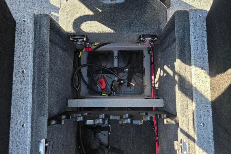 Slide: The Image of Interior view of 2026 Smoker Craft Adventurer 178 DC boat wiring and storage compartment. - 23