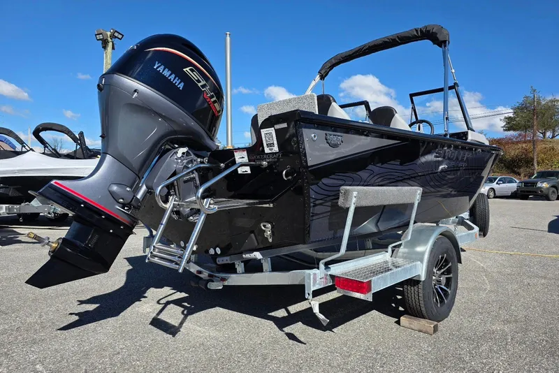Slide: The Image of 2026 Smoker Craft Adventurer 178 DC boat with Yamaha engine on trailer. - 3