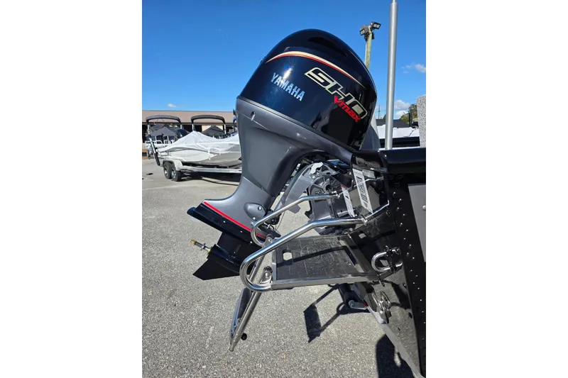 Slide: The Image of 2026 Smoker Craft Adventurer 178 DC with Yamaha outboard motor in a parking lot. - 9