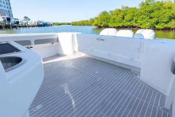 Slide: The Image of 2023 Intrepid 438 Evolution boat deck with sleek design and spacious layout. - 14