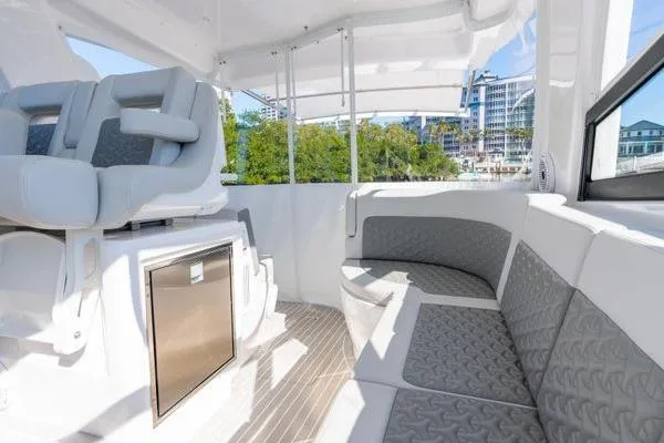 Slide: The Image of 2023 Intrepid 438 Evolution boat interior with modern seating and sleek design. - 20